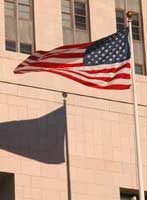 American flag flying in front of a California Federal building