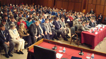 ...before a standing-room-only audience in the Hart Senate Office Building.