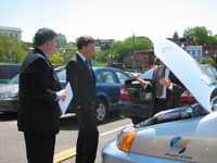 Congressman Rogers takes a look at a Honda car.