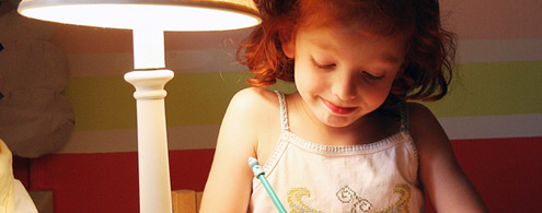 Little girl writing.