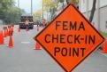 Honolulu, HI, May 17, 2008 -- Sign informing of a FEMA check-in point.  FEMA's Pacific Area Office Distribution Center is providing requested aid ...