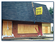 Graphic of a store with the windows boarded up.