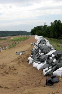 Oakville, Iowa, June 27, 2008 -- Sandbags remain piled on top of the Iowa River levee. Local residents, friends, family and volunteers pitched in ...