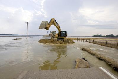 Oakville, Iowa, July 6th, 2008--The Army Corps of Engineers works to repair a road to improve access into Oakville. This will also contain the flo...