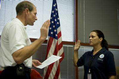 Galveston, TX, December 9, 2008 -- Deputy FEMA Administrator Harvey Johnson swearing in Kimberly Cormier as FEMA's newest local hire employee. Ms....