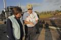 Bridge City, TX, November 12, 2008 -- FEMA FCO, Sandy Coachman looks at a housing site plan for mobile homes with Carl Miller, the Army Corps of E...