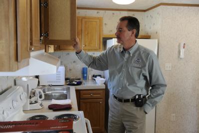 Beaumont, TX, November 25, 2008 -- FEMA Administrator R. David Paulison taking a tour through a newly placed mobile home in Beaumont during a rece...