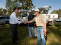 Vidor, TX, November 6, 2008 -- FEMA administrator R. David Paulison greets workers from Entergy power company in a mobile home park where several ...
