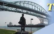 Image of the Thomas Edison Statue, the Blue Water Bridge, and a Great Lakes Freighter