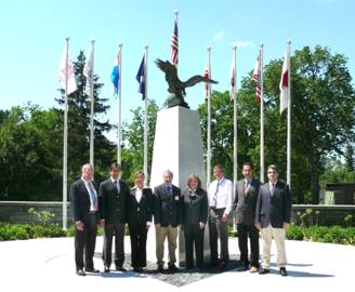 Professors from Istanbul Technical University (ITU) stand with Emergency Management Institute (EMI) officials in front of the National Civil Defense Memorial.