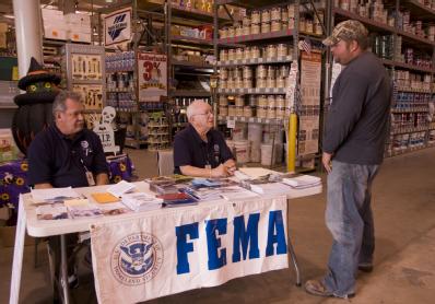 Port Arthur, TX, October 23,2008 -- FEMA personnel talk to a resident of Port Arthur who had questions about rebuilding his home which was damaged...