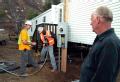 Delzura, CA, December 5, 2007 -- FEMA applicant Jon Grice, right, watches as electricians Adam Murschel, left, and Franklin wood, both of O'Donnel...