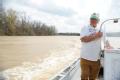 De Valls Bluff, AR, March 26, 2008 -- Lester Gaither surveys the area near his home on the White River as it continues to rise, impacting homes al...