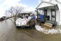 Biscoe, AR, March 26, 2008 -- Locals volunteer stack sandbags in an effort to save houses near the Cache River, a tributary of the White River, wh...