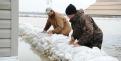 Biscoe, AR, March 28, 2008 --  Philip Lightsey, left, and his son Josh, check the water levels around the sandbags which encompass his house.  The...