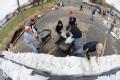 Fenton, MO, March 21, 2008 -- Residents and area volunteers band together to fill sand bags and stack them next to businesses and property on the ...