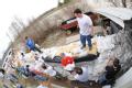Fenton, MO, March 21, 2008 -- Local residents and area volunteers band together to stack sandbags next to businesses and property on the Meramec R...