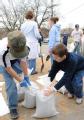 Fenton, MO, 03/23/2008 -- Local residents and volunteers prepare sandbags for walls to help prevent the water from flooding local structures.

J...