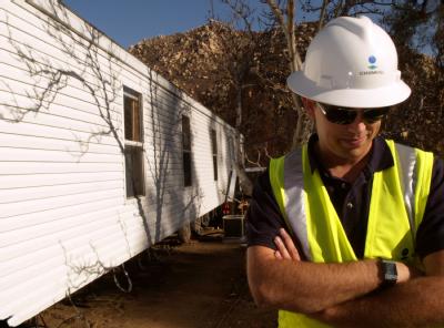 Delzura, CA, December 5, 2007 -- FEMA Technical Assistance Coordinator John Kalb is overseeing efforts to install this FEMA provided mobile home f...