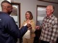 Elzura, CA, December 8, 2007 -- Operations Special Assistant Kenneth Tingman, left, hands Jon and Leighann Grice the keys to a mobile home provide...