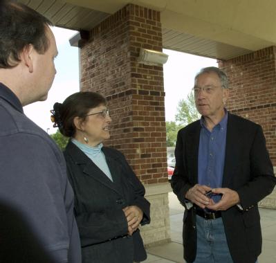 Waverly, IA, June 14, 2008 -- Senator Chuck Grassley, R-IA meets with FEMA Congressional representative Jodi Bruckner before a town hall meeting i...