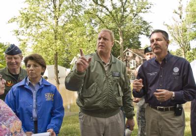 Waterloo, IA, June 13, 2008 -- FEMA Administrator R. David Paulison, Iowa Governor Chet  Culver and others meet with some of the Waterloo, IA resi...