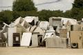 Waverly, IA, June 21,2008  -- Piles of 'white trash', appliances which include washers, dryers and refrigerators, wait to be removed from the town...