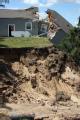 Lake Delton, WI, June 23, 2008 - This house and others have fallen into Lake Delton due to flooding and erosion when the dam broke and moved the f...