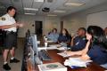 Walworth, Wisconsin, June 21, 2008-- Lt. Kevin Williams of the Walworth County Sheriff's Office briefs a FEMA Preliminary Disaster Assistant team ...