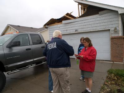 Windsor, Colorado, May 26, 2008 --Fred Turner with FEMA's Community Relations teams talks with residents affected by the storm. Photo: Michael Rie...
