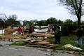Parkersburg, IA, May 28, 2008 -- The young people in the community of Parkersburg, assist their neighbors, following EF-5 tornado that hit Parkers...