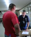 Parkersburg, IA, May 28, 2008 -- FEMA Community Relations Team member, Gary O'Hare, from Oak Grove,Missouri, assists Parkersburg resident at the D...