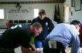 Parkersburg, IA, May 28, 2008 -- FEMA External Affairs Field Specialist, Jacqueline Chandler (c), assists Parkersburg residents at the Disaster Re...