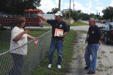 Immokalee, FL, September 13, 2008 -- FEMA  Community Relations(CR) Specialist Vernon Andrews and State Emergency Response Team (SERT) member are g...