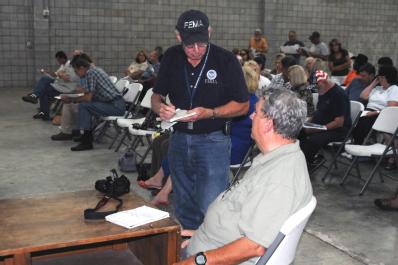 Callahan, FL, September 17, 2008 -- Prior to the Nassau Community flood concerns meeting, FEMA Public Information Officer(PIO) Nate Custer speaks ...