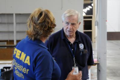 Ft. Pierce, FL, September 15, 2008 -- At the St. Lucie County FEMA/State Disaster Recovery Center(DRC), FEMA DRC Manager Tom Giddings speaks with ...