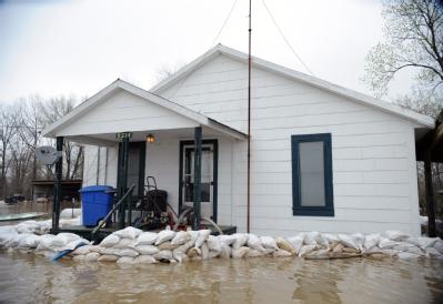 Biscoe, AR, March 28, 2008 -- This house is surrounded by sand bags to protect it from flood waters from the Cache River, a tributary of the White...