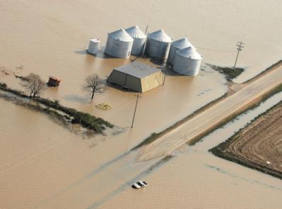 Northeastern Arkansas, AR, March 26, 2008 --  Aerial of agricultural storage units isolated by the flooded Black River after torrential rains.  FE...