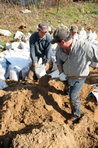 Des Arc, AR, March 25, 2008 -- Members of the community band together to fill sandbags for an operation going on near a levee in an area called Sa...