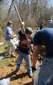 Des Arc, AR, March 25, 2008 -- Community members, including children, fill sandbags for an operation going on near a levee in an area called Sandh...
