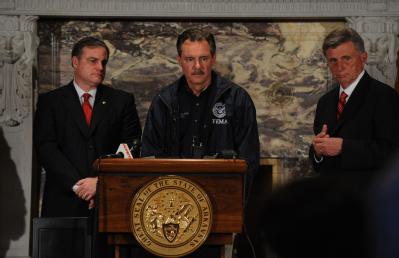 LIttle Rock, AR, March 31, 2008 -- FEMA Administrator David Paulison, center, responds to reporters at a press conference  with Arkansas Governor ...