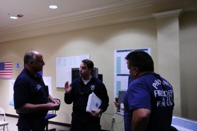 Baton Rouge, LA, September 1, 2008 --  Department of Homeland Security (DHS), Secretary's Chief of Staff, Chad Sweet (center) discusses Search and...