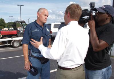 Atlanta, GA, August 31, 2008 -- Urban Search and Rescue (US&R) Information Officer Louie Fernandez, left, is interviewed by Ryan Deal, a reporter,...