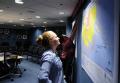 Washington, DC , August 28, 2008 --  Manuela Rayner (front) and Sarah Schoenborn, FEMA Mapping Division, prepare the National Response Coordinatio...