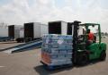 Carville, LA, August 29, 2008 -- FEMA employee drives a fork lift with water bottles being loaded on to a truck that will be sent to designated to...