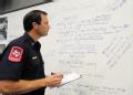 San Antonio, TX, August 29, 2008 -- San Antonio Fire Chief and Emergency Operations liaison, Steve Reuthner looks at an operations board in the Al...