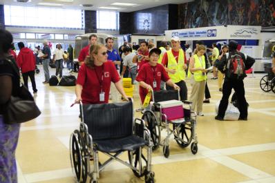 New Orleans, LA, September 6, 2008 --  Volunteers push their wheelchairs to arriving trains in New Orleans as residents returned from evacuation d...