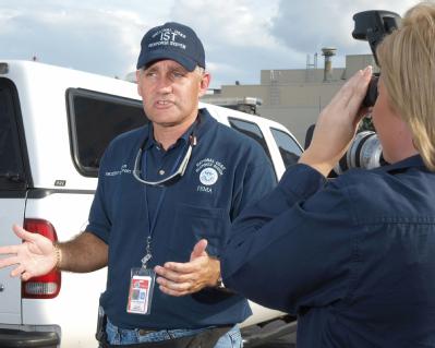 Atlanta, GA, August 31, 2008 -- Urban Search and Rescue (US&R) Information Officer Louie Fernandez, left, is interviewed by FEMA Public Informatio...