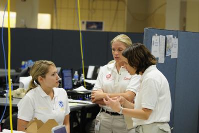 Baton Rouge, LA, August 31, 2008 --  Kelli Cassels (L), FEMA's National Incident Management Assistance Team (IMAT) member discusses Hurricane Gust...