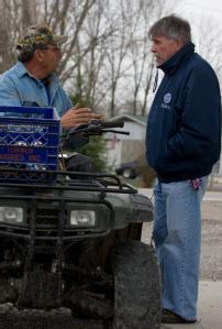 Dutchtown, MO , March 29, 2008 -- FEMA Representative, Jack Heesch listens to flood victim, Doyle Parmer following the Mississippi river flooding ...